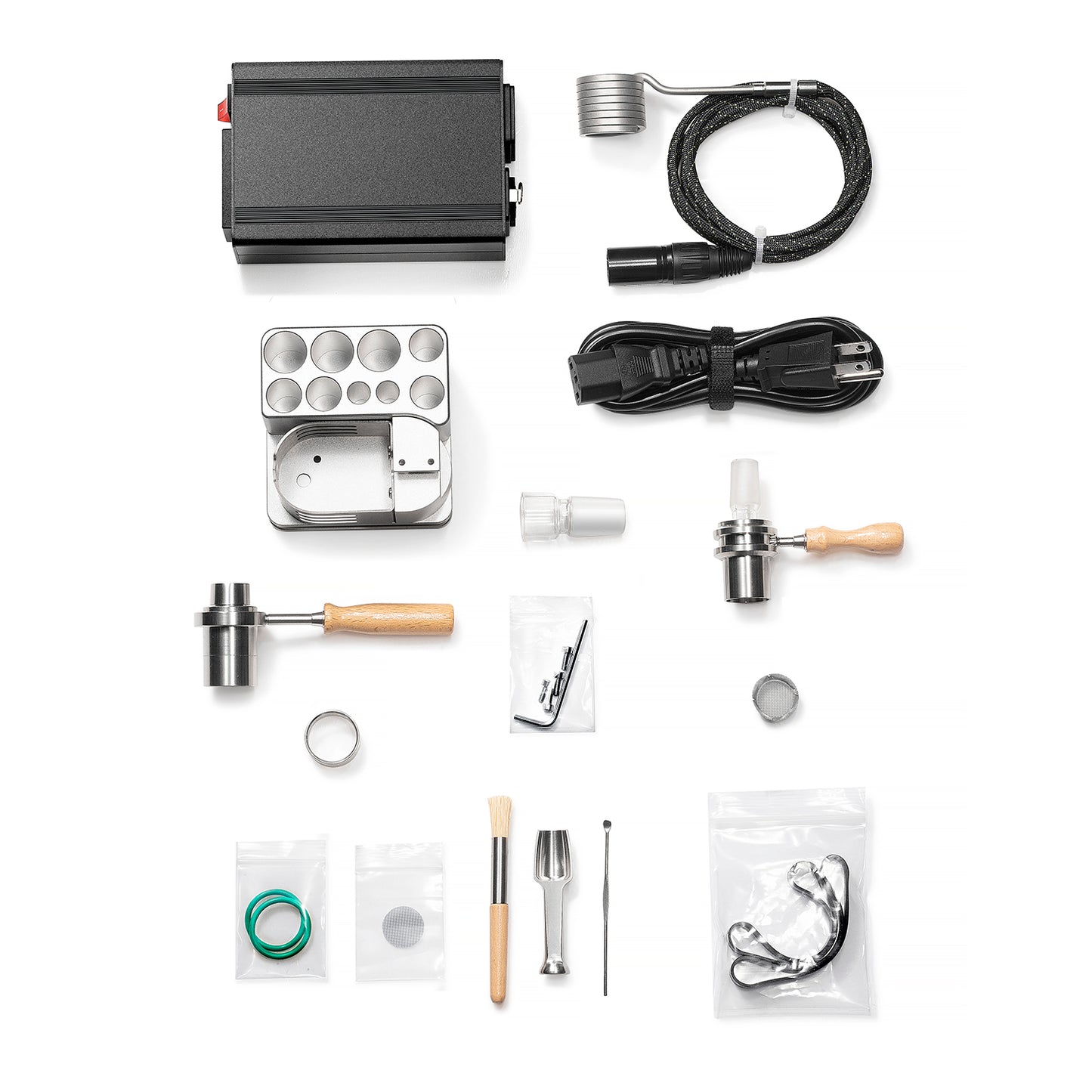 Complete wireless ball vape kit showing titanium heater, PID controller, and accessories arranged professionally